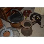 A brass coal helmet and a vintage metal jug