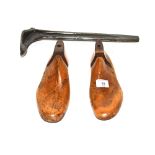 Two vintage wooden shoe trees and an iron boot las