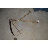 A two handled scythe with wooden cradle