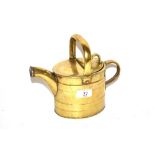 An Antique brass water can