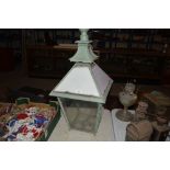 An Antique green painted and opaque glass panel lantern