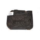 An ebonised printer's block depicting an early ste