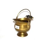 A miniature brass coal helmet