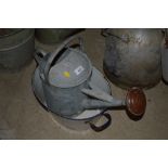 A Geldry 1 1/2 gallon watering can with copper ros