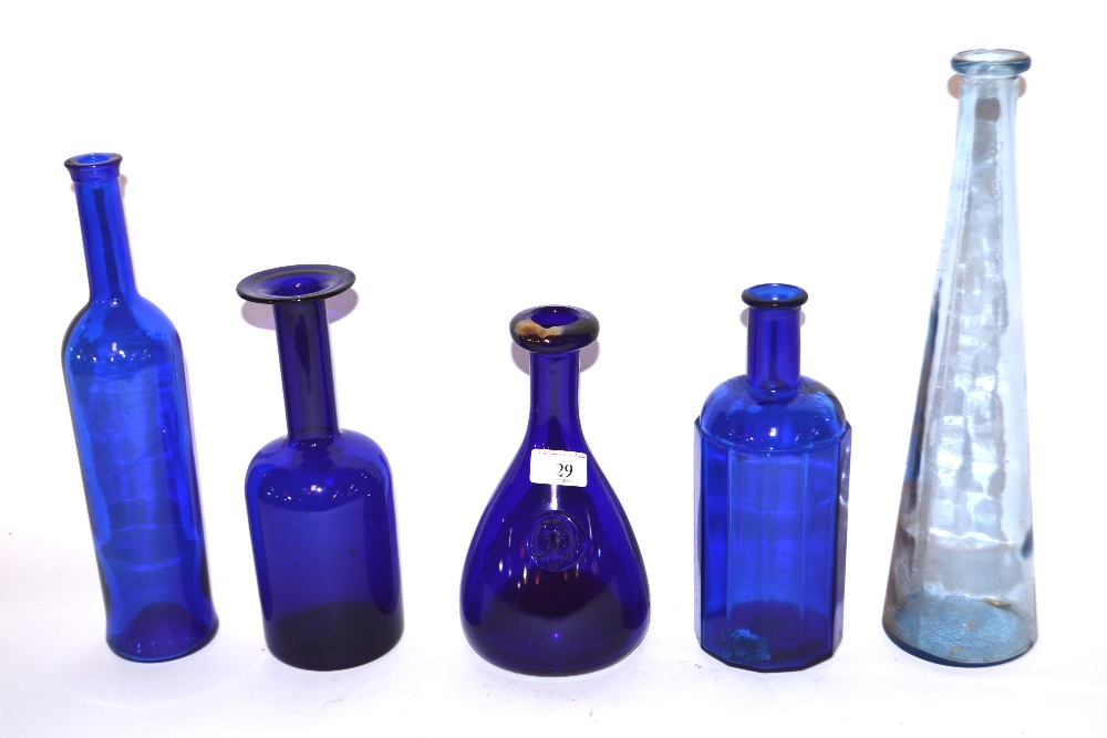 A collection of blue Scandinavian glass bottles et