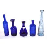 A collection of blue Scandinavian glass bottles et