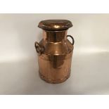 A coppered five gallon milk churn