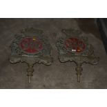 A pair of cast metal and ornate lectern tops