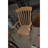 A slat back rocking chair