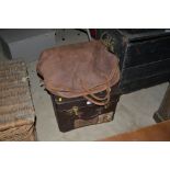 A leather holdall and a travelling toilet case wit