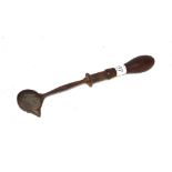 An early Antique metal ladle with turned wooden ha