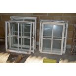 A quantity of old wooden sash windows