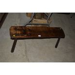 An old elm rustic pig bench