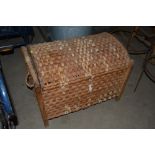 A woven and wicker domed top trunk