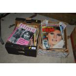 Two boxes containing various vintage film and phot