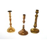 Three various Antique brass candlesticks