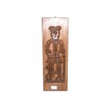 A carved wooden gingerbread mould depicting a gent