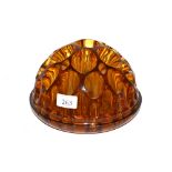 An Art Deco amber glass flower frog