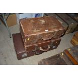 Three various vintage suitcases