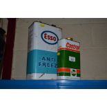 An Esso antifreeze can and a Castrol oil can
