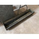 A cast iron feed trough