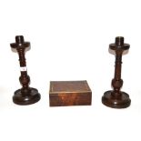 A pair of 19th Century turned oak candlesticks and