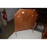 A copper Art Deco fire screen