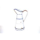 A vintage enamel water jug