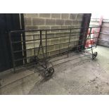 A vintage iron wheeled hurdle