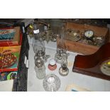 A collection of various glass oil lamps