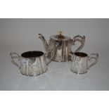 A three piece plated tea set