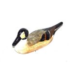 A painted wooden decoy duck