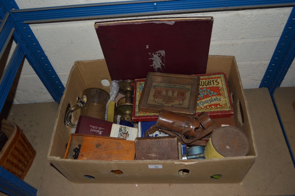 A box containing a collection of vintage games, an