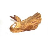 A carved wooden decoy type duck model