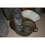 A small oval galvanised twin handled bath, a galvani
