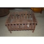 An Antique iron fire basket