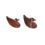 A pair of small carved hardwood duck ornaments