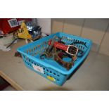 A plastic basket of various wrist watches