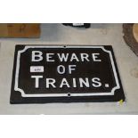 A cast metal "Beware of the Trains" sign (132)