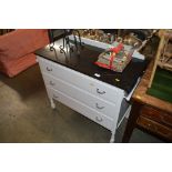 A white painted chest fitted three drawers with a