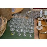 A collection of wine glasses and a vase