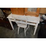 A white painted child's table lacking drawers; tog