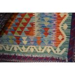 An approx 4'6" x 2'10" vegetable dye Kelim rug