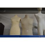 Two mannequin torsos