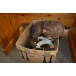 A box of various soft toys in the form of monkeys