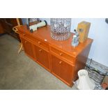 A teak sideboard fitted two drawers
