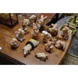 A collection of collector's pig ornaments
