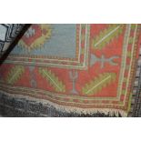 An approx 5'7" x 4' patterned rug