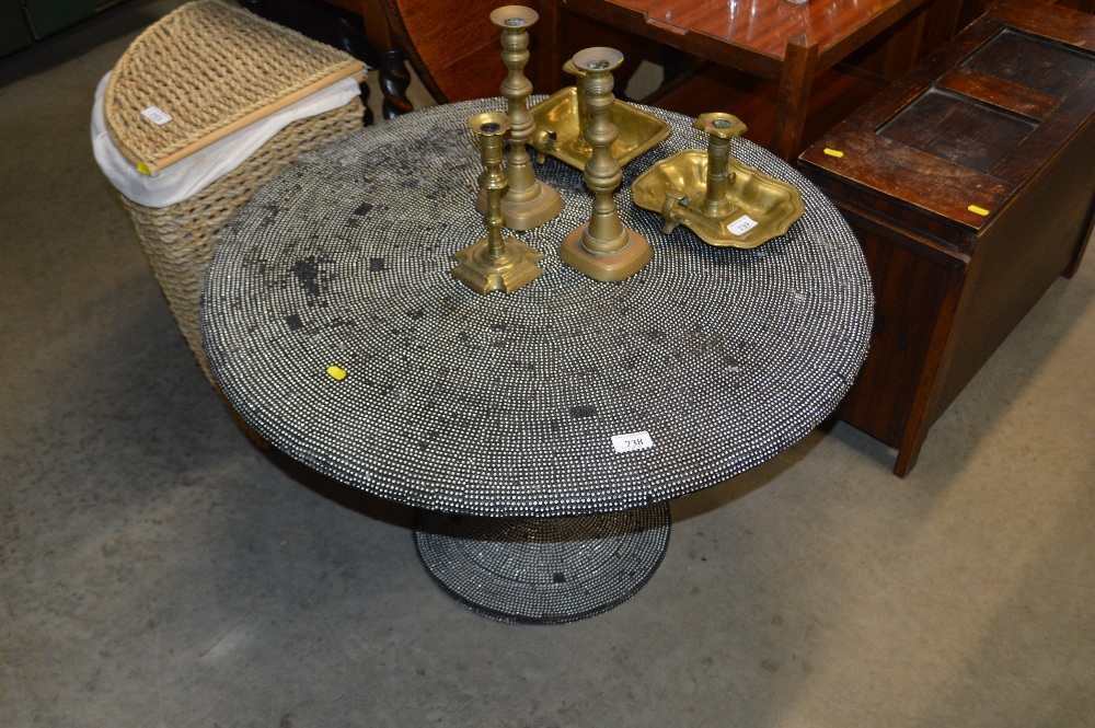 A circular metal table