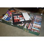 Three boxes containing various DVD's; a photo tray
